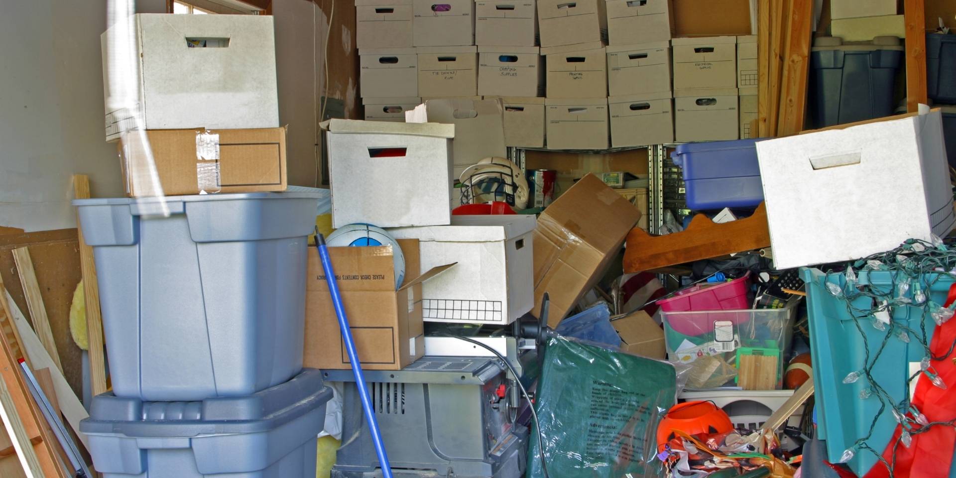 garage that is full of boxes and clutter