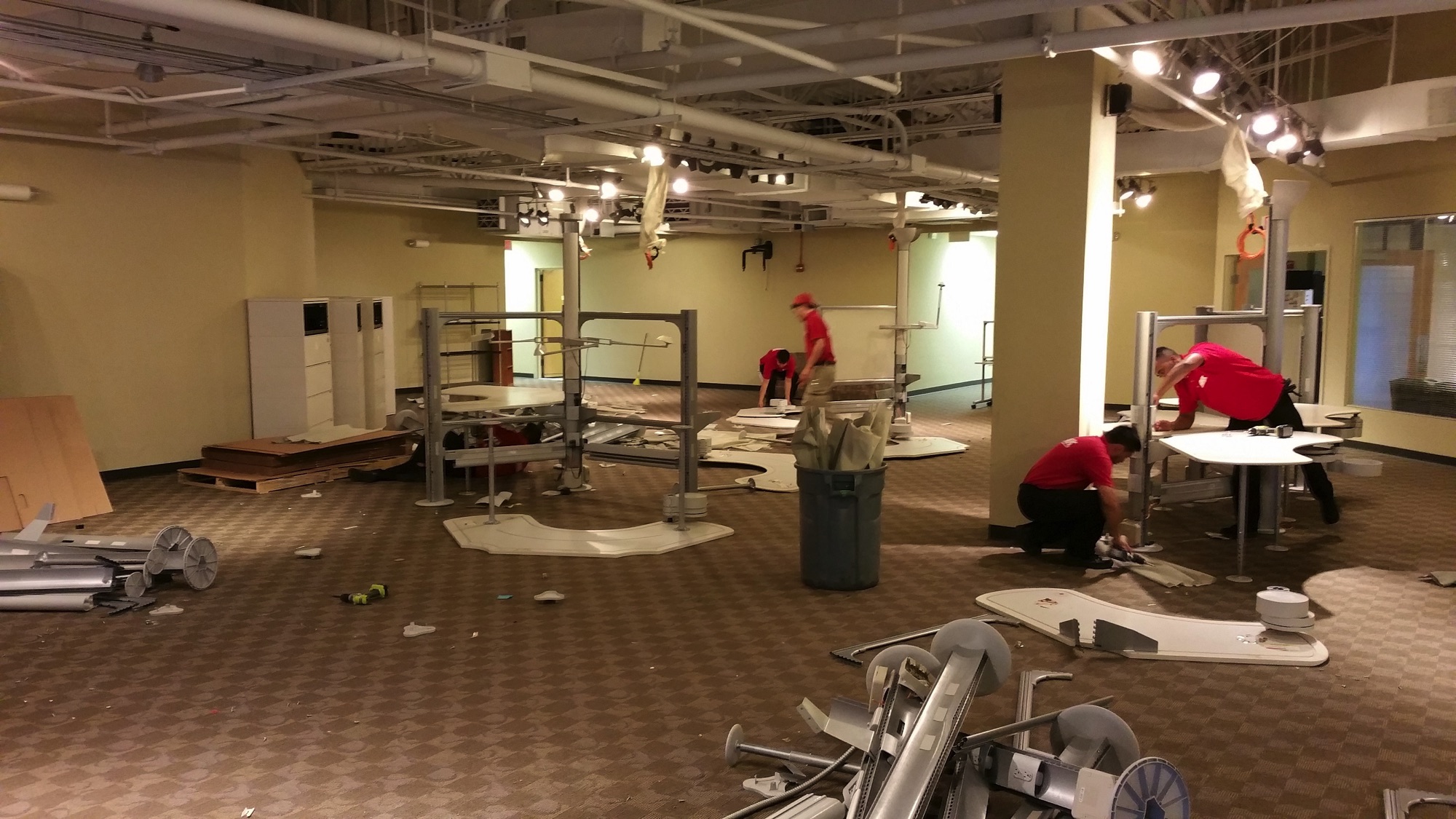 people moving furniture out of an office