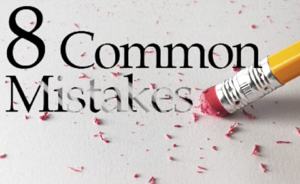 Pencil erasing the words “8 Common Mistakes” with pink eraser shavings scattered across the surface
