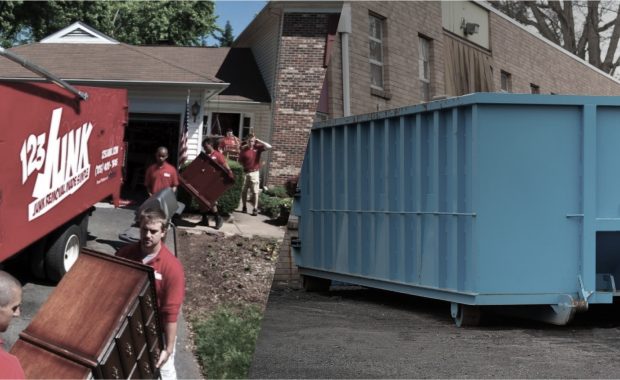 Workers loading furniture into a 123JUNK truck on the left and a large empty blue dumpster on the right