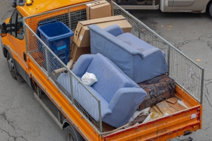 Old Sofa Discard Furniture in Junk Removal Truck