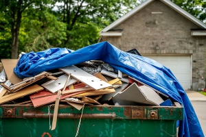 Renovation Waste Piled in A Green Dumpster for Recycling