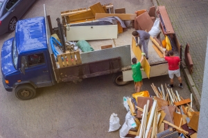 Removal Workers Loading Old Furniture on Truck