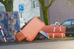 Bulky Pickup Pile of Sofas and Chairs Left Roadside for Collection of Junk Removal Service