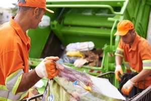 Professional Workers Loading Garbage to Truck After Junk Removal