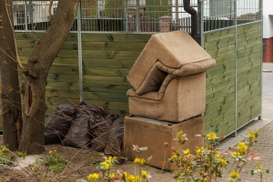 Discarded Old Armchairs and Trash Bags Showing Improper Junk Disposal