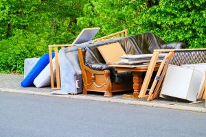 Discarded Furniture and Mattresses Piled Up on the Curb for Free Pickup